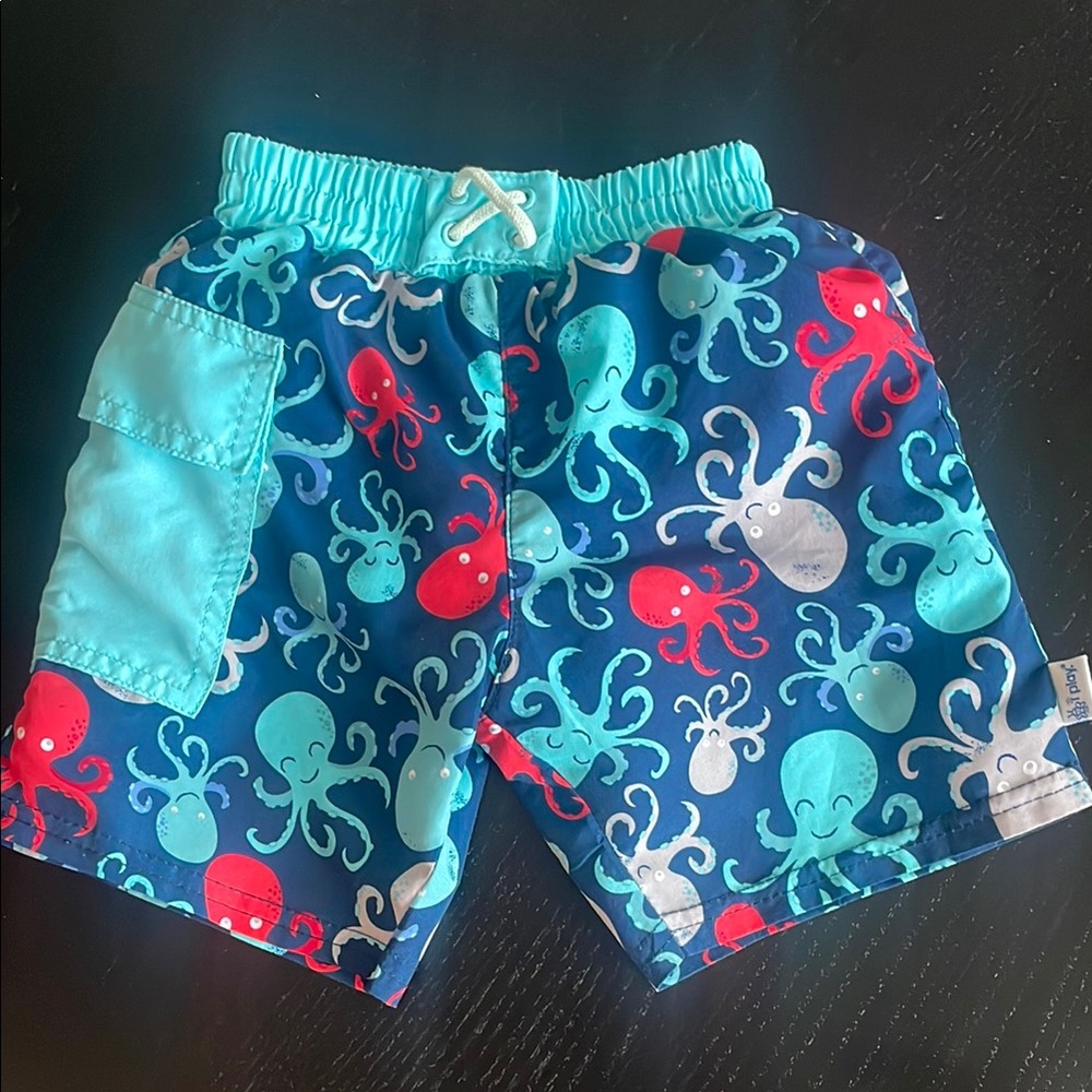 i play. Blue and Red Swim Trunks with Nautical Theme